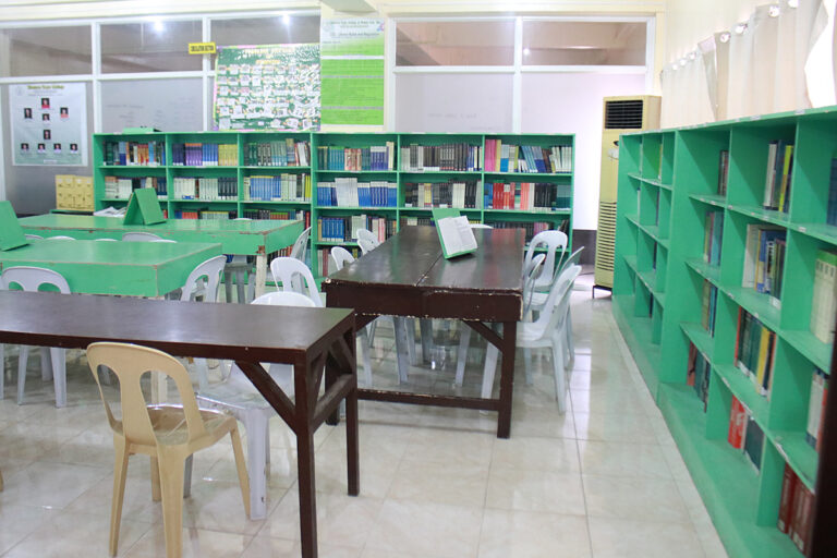 Study tables and book collections inside the WLC Library
